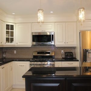   Transitional White Painted Kitchen With Dark Island