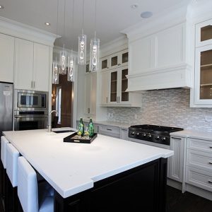Custom made, high- end kitchen designed and built in a new house. Nine feet ceiling. Cabinets reached to the ceiling with double stack glass Kitchen cabinets, riser and crown molding. Painted MDF kitchen. Built in appliances. Quartz counter top and sink on the island. Kitchen design and built by JK. Richmond hill 2015