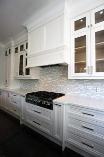 New house, Custom made kitchen cabinets. Double stack kitchen. Custom made mantel hood and glass doors. Pot drawers under cook top. Spice rack pull outs to provide maximum space in kitchen area. Kitchen designed and built by JK- Richmond hill 2015