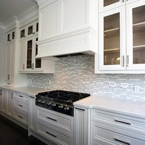 New house, Custom made kitchen cabinets. Double stack kitchen. Custom made mantel hood and glass doors. Pot drawers under cook top. Spice rack pull outs to provide maximum space in kitchen area. Kitchen designed and built by JK- Richmond hill 2015