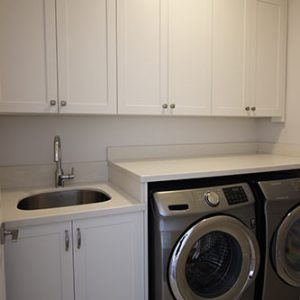Laundry renovation Custom Made Laundry Cabinets and stone counter top. Design and built by JK Richmond Hill.