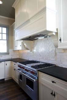  Transitional White Kitchen With Mantel Hood And Black Countertop