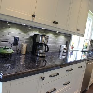   Georges Angola Black Granite Countertop Taupe Glass Backsplash
