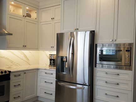 Transitional off white painted kitchen. nine feet ceiling, double stack cabinets. With riser and crown molding reaches to ceiling. Kitchen design and built by Joseph kitchen. Markham 2018.