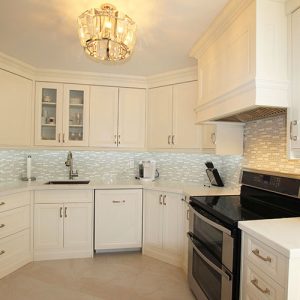 Condo kitchen renovation.Transitional Painted Kitchen Off White cabinets. Kitchen design and built by JK. 2015 North York.