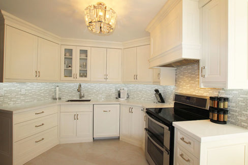 Condo kitchen renovation.Transitional Painted Kitchen Off White cabinets. Kitchen design and built by JK. 2015 North York.