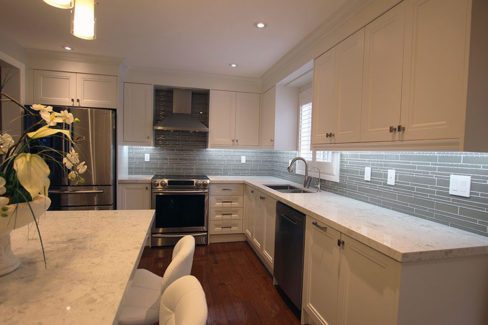   Transitional White Kitchenpainted Mdf Flat Panel Quartz Countertop And Glass Backsplash