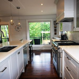 Kitchen renovation. Custom made painted MDF Kitchen. white quartz counter top. Large island and double sink on the island. Thornhill 2017