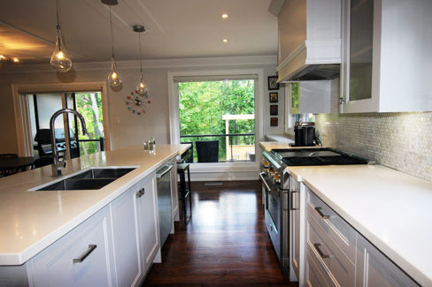 Kitchen renovation. Custom made painted MDF Kitchen. white quartz counter top. Large island and double sink on the island. Thornhill 2017