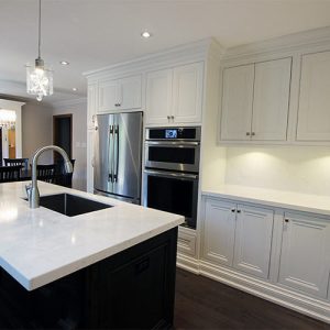 Custom made solid wood kitchen. Painted off white kitchen cabinets and stained island. Custom made wall unit in breakfast area. Designed and built by JK, North York 2017