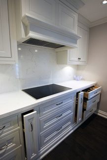 Solid wood white Kitchen- White quartz counter top and back splash. Solid wood dovetail joint drawers and quiet close hinges. Designed and built by JK. North York 2017