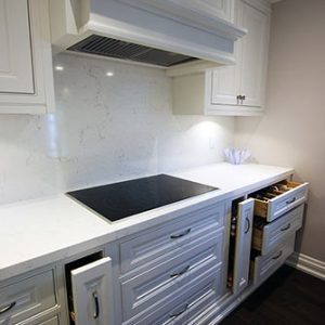 Solid wood white Kitchen- White quartz counter top and back splash. Solid wood dovetail joint drawers and quiet close hinges. Designed and built by JK. North York 2017