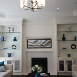 Painted white wall unit. Glass shelves and mesh doors. Designed and built by JK. Toronto