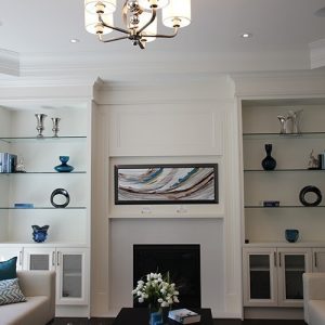 Painted white wall unit. Glass shelves and mesh doors. Designed and built by JK. Toronto