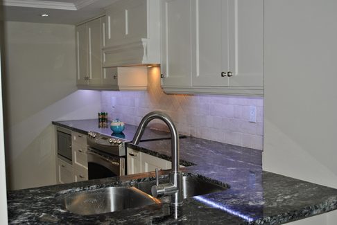 Full kitchen renovation by Joseph kitchen. Dark Granite Counter top. Built in microwave in base cabinet. North York 2014