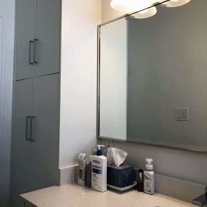 Bathroom remodeling in Markham. Custom made white modern vanity. Quartz countertop. Custom made wall closet in bathroom. Design and built by Joseph bathrooms.