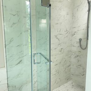 Bathroom renovation in Whitby. white and gray calacatta tiles Toronto.
