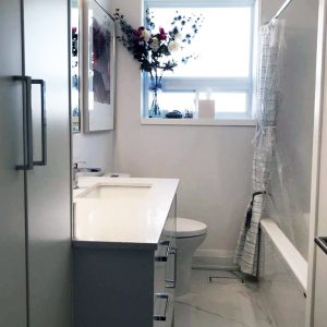 Bathroom renovation. Modern custom made high gloss vanity. Bathroom porcelain floor. Custom made bathroom wall closet. Markham. Design built by Jk.