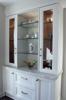 Custom made hutch in breakfast area. Glass shelves and glass doors. Designed and built by Joseph Kitchen. North York