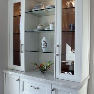 Custom made hutch in breakfast area. Glass shelves and glass doors. Designed and built by Joseph Kitchen. North York