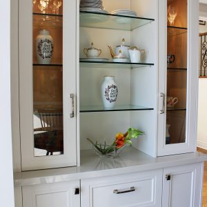 Custom made wall unit. Painted off white with glass doors. Design and built by Joseph kitchen Toronto
