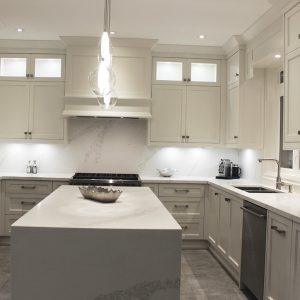 Waterfall island. White and gray quartz  stone for kitchen, island and backsplash. Markham 2019