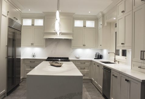 Waterfall island. White and gray quartz  stone for kitchen, island and backsplash. Markham 2019