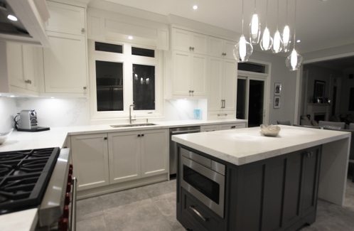Two tone kitchen. White cabinets and gray island. Water fall island with white and gray Calacatta pattern. for a luxury look. Designed and built by Joseph kitchen. Markham 2019