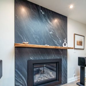 Fire place renovation, quartz wall stone and walnut wood floating shelf. Design & build by JK Markham .