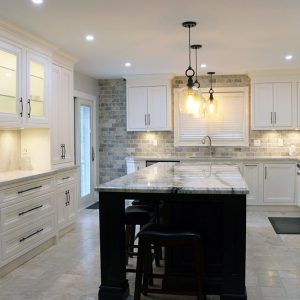 Custom made, solid wood painted kitchen cabinets. Painted in off white. With riser & crown molding reached to the ceiling. Designed and built by JK 2017 Richmond Hill.