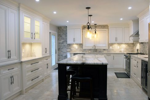 Custom made, solid wood painted kitchen cabinets. Painted in off white. With riser & crown molding reached to the ceiling. Designed and built by JK 2017 Richmond Hill.