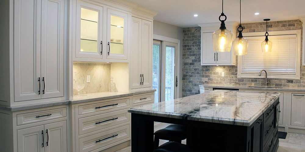 Custom designed kitchen cabinets. Solid wood framed painted kitchen. Pantry on the counter top. Glass doors to the wall unit area. Designed and built by JK 2017 Richmond Hill.