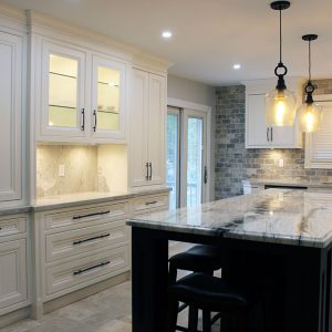 Custom designed kitchen cabinets. Solid wood framed painted kitchen. Pantry on the counter top. Glass doors to the wall unit area. Designed and built by JK 2017 Richmond Hill.