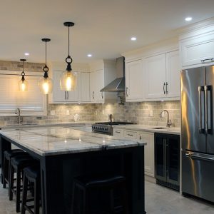 Every kitchen designed specifically for the clients needs. High- end framed solid wood kitchen finished in off white paint and stained island. Built in appliences. By JK 2017 Richmond Hill.