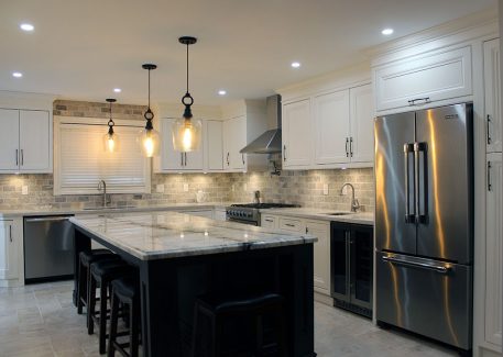 Every kitchen designed specifically for the clients needs. High- end framed solid wood kitchen finished in off white paint and stained island. Built in appliences. By JK 2017 Richmond Hill.