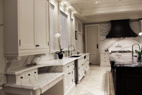 Framed solid wood kitchen cabinets. Copper hood and stained island in dark brown. Counter by Cambria by JK North York 2018