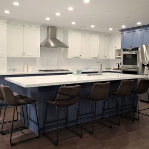 High end kitchen remodeling in Toronto Two tone modern kitchen cabinets. White and blue painted MDF cabinets White quartz countertop and back splash Conestructed in