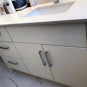 High gloss modern European vanity. Custom made vanity quartz countertop. Design built and installation by Joseph kitchen and Bath. Thornhill
