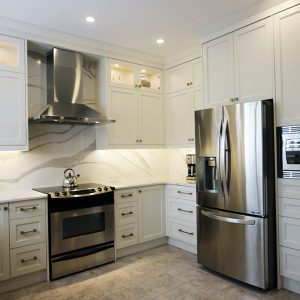 Full kitchen make over by Joseph kitchen. Off white painted cabinet doors. Maple wood kitchen cabinet. Built in appliances, Extra drawers in base cabinets. Cambria quartz counter top. Kitchen design and built by Joseph Kitchen. Markham 2018.