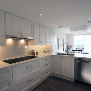 Kitchen make overcustom made transitional painted off white solid maple wood kitchen cabients. Gelux counter top. Built and design by Joseph kitchen Toronto