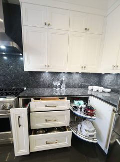 Kitchen pull out and organizers. Magic corner pull out and spice pull outs. Automatic European hardware for our kitchens we design and built. Kitchen design and built by JK 2021