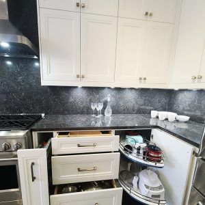 Kitchen pull out and organizers. Magic corner pull out and spice pull outs. Automatic European hardware for our kitchens we design and built. Kitchen design and built by JK 2021