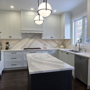 Kitchen remodeling by JK in Aurora tall ceilling and tall cabinets painted MDF, countertop from Cambria