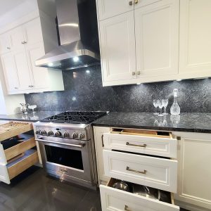 Kitchen remodeling in GTA. Kitchen organizers and kitchen pull outs. Richmond Hill. Kitchen design and construction by Joseph Kitchen and Bath. Painted off white kitchen cabinets and dark quartz counter top and backsplash. Project contractor JK 2021