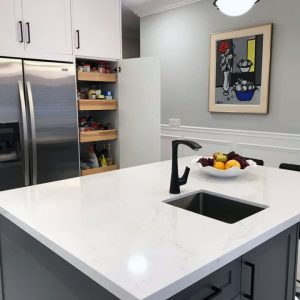 Kitchen remodeling in Richmond Hill. white and gray painted cabinets. sink on the island. Solid wood drawers. pull out pantry. design built by JK