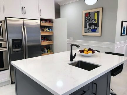 Kitchen remodeling in Richmond Hill. white and gray painted cabinets. sink on the island. Solid wood drawers. pull out pantry. design built by JK