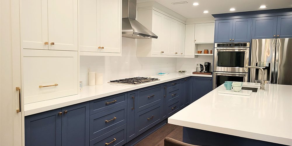 Kitchen renovation downtown Toronto White and blue custom made cabients custom installation two tone painted kitchen cabients European hardware Design and built by Joseph kitchen