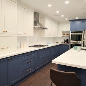 Kitchen renovation downtown Toronto White and blue custom made cabients custom installation two tone painted kitchen cabients European hardware Design and built by Joseph kitchen