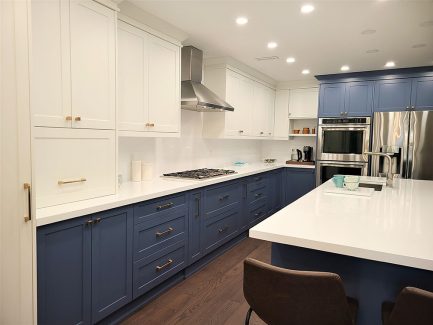 Kitchen renovation downtown Toronto White and blue custom made cabients custom installation two tone painted kitchen cabients European hardware Design and built by Joseph kitchen