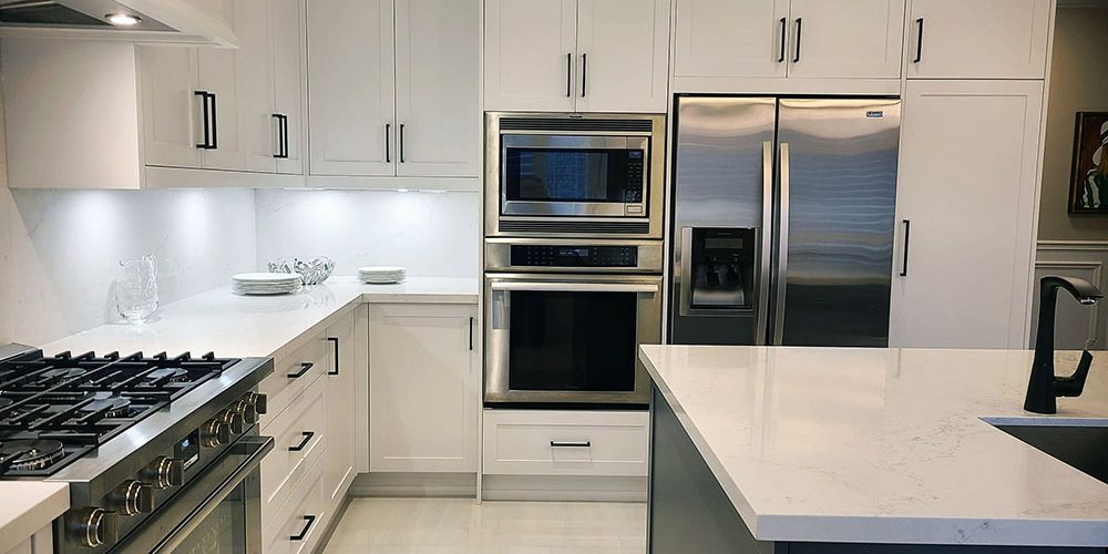 Kitchen renovation in Richmond Hill. Custom kitchen cabinets. Two tone white and gray kitchen design. Canadian quartz countertop and backsplash. Kitchen renovation in Richmond Hill. Custom kitchen cabinets. Two tone white and gray kitchen design. Canadian quartz countertop and backsplash.